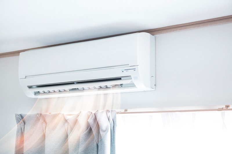 Ductless unit above window showing air flow.