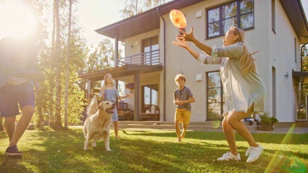 family playing outside in the sun.